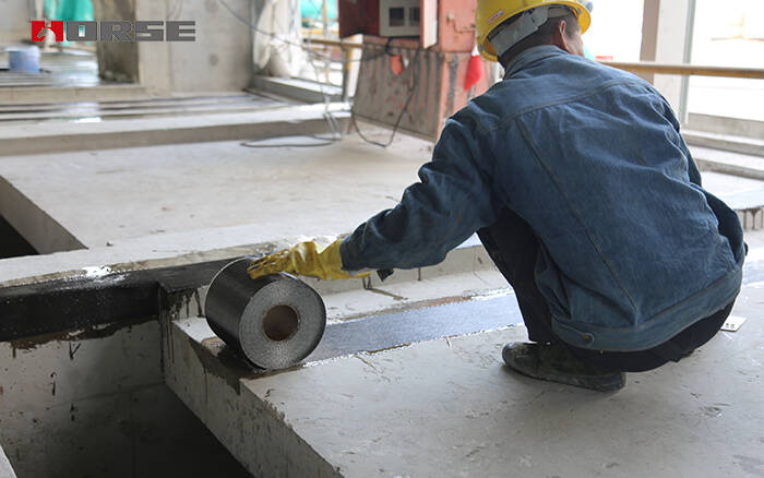 Applying carbon fiber impregnating adhesive for CFRP strengthening Applying carbon fiber impregnating adhesive for CFRP strengthening