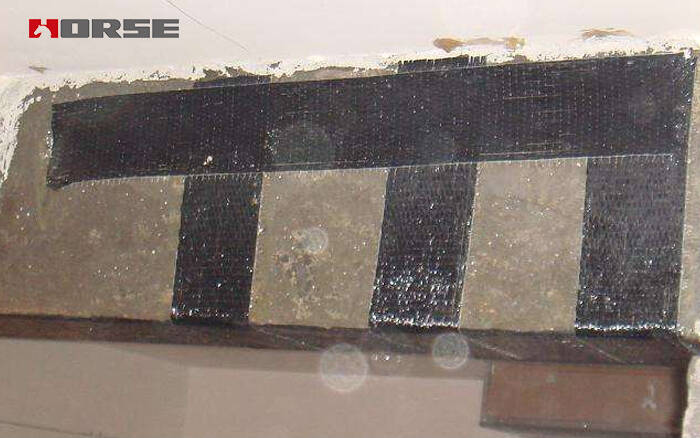 1629103341298947.jpg Construction operation of CFRP U shaped hoop.jpg